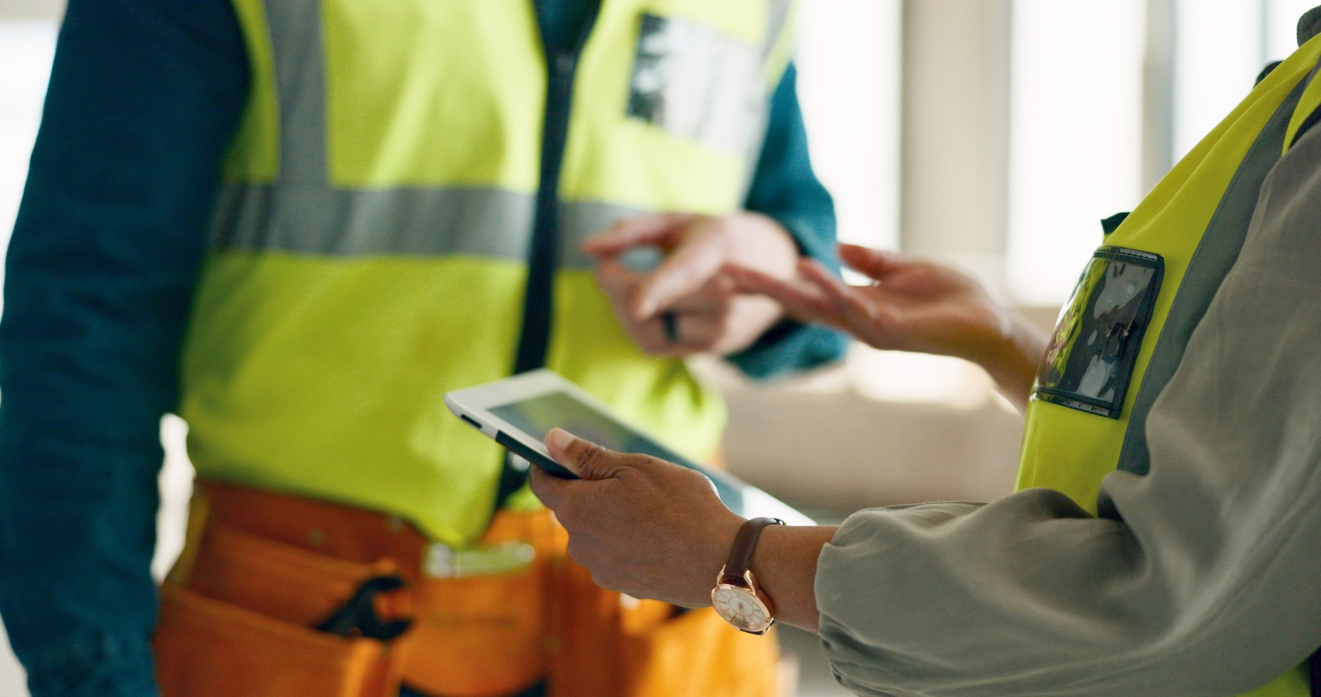 Engineer, hands and construction worker with tablet for team planning, logistics and collaboration on site with online blueprint. Civil engineering, project and people check industrial plan on tech